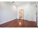 Bedroom featuring hardwood floors with views into the bathroom and closet at 1155 Custer Se Ave # 209, Atlanta, GA 30316