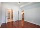 Bedroom featuring hardwood floors with views into the bathroom and kitchen at 1155 Custer Se Ave # 209, Atlanta, GA 30316