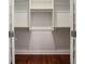 Open white closet with shelving and hanging rods at 1155 Custer Se Ave # 209, Atlanta, GA 30316