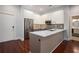 Modern kitchen with gray cabinets, stainless steel appliances, and dark hardwood floors at 1155 Custer Se Ave # 209, Atlanta, GA 30316