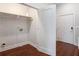 A simple laundry room with shelving, power outlet and door at 1155 Custer Se Ave # 209, Atlanta, GA 30316