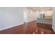 Open-concept living area featuring hardwood floors and a modern kitchen with stainless steel appliances at 1155 Custer Se Ave # 209, Atlanta, GA 30316