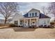 Exterior of home with a large backyard, covered patio, and manicured landscaping at 1515 Walker Ave, Atlanta, GA 30337