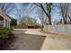 View of backyard featuring a wood fence, grass, and landscaping at 1515 Walker Ave, Atlanta, GA 30337