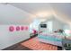 Bedroom showcases a light fixture, colorful bedspread, and a geometric patterned rug at 1515 Walker Ave, Atlanta, GA 30337