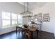 Elegant dining room with a large window, dark wood floors, and stylish lighting at 1515 Walker Ave, Atlanta, GA 30337