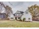 Charming two-story white brick home with a manicured lawn and inviting front porch at 1515 Walker Ave, Atlanta, GA 30337