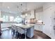 Modern kitchen featuring white cabinets, granite countertops, and a large center island with seating at 1515 Walker Ave, Atlanta, GA 30337