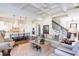 Comfortable living room with a kitchen, featuring hardwood floors, a fireplace, and elegant decor at 1515 Walker Ave, Atlanta, GA 30337