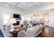 Open-concept living room flowing into a modern kitchen with white cabinets and a spacious island at 1515 Walker Ave, Atlanta, GA 30337