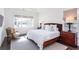 Sun-filled bedroom with neutral walls, hardwood floors, and classic furniture at 1515 Walker Ave, Atlanta, GA 30337