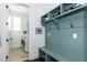 Well-organized mudroom with built-in storage, seating, and access to the laundry area at 1515 Walker Ave, Atlanta, GA 30337