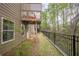 Townhouse backyard features black iron fence and patio at 2705 Maple Park Pl # 29, Cumming, GA 30041