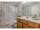 Well-lit bathroom featuring a single sink, and a shower with patterned curtains at 2705 Maple Park Pl # 29, Cumming, GA 30041