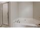 Bright bathroom features a soaking tub and tiled shower with a glass door at 2705 Maple Park Pl # 29, Cumming, GA 30041