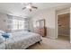 Bright bedroom with vaulted ceilings, large windows, and a wooden dresser at 2705 Maple Park Pl # 29, Cumming, GA 30041