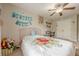 Bedroom features a ceiling fan, desk and chair, and decorations on the wall at 2705 Maple Park Pl # 29, Cumming, GA 30041