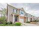 Street view of townhomes with brick accents, attached garages, and manicured front yards at 2705 Maple Park Pl # 29, Cumming, GA 30041