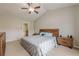 Spacious main bedroom with ceiling fan and hardwood furniture at 2705 Maple Park Pl # 29, Cumming, GA 30041