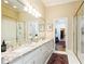 Well-lit bathroom with double sinks, granite countertops, and plenty of storage space at 3022 Loridan Se Way, Atlanta, GA 30339