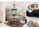 Sunlit breakfast nook with large windows overlooking the pool, complete with stylish decor at 3022 Loridan Se Way, Atlanta, GA 30339