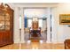 Dining room with columns, chandelier, and blue accent wall at 3022 Loridan Se Way, Atlanta, GA 30339