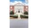 Elegant building featuring a grand staircase, complemented by manicured landscaping and classic architectural details at 3022 Loridan Se Way, Atlanta, GA 30339