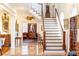 Spacious entrance hall showcasing staircase, marble tile, and inviting transitional design at 3022 Loridan Se Way, Atlanta, GA 30339