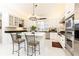 Stylish kitchen with white cabinetry, an island, stainless steel appliances, and modern lighting at 3022 Loridan Se Way, Atlanta, GA 30339