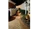 Brick walkway featuring garden lighting, shrubbery, and a white fence, leading to the backyard at 3022 Loridan Se Way, Atlanta, GA 30339