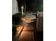 Curved brick walkway featuring garden lighting, shrubbery, and a white fence, leading to the backyard and pool at 3022 Loridan Se Way, Atlanta, GA 30339