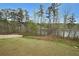 Expansive backyard with a partial fence and beautiful lake views, great for recreation at 3725 Rifflewood Way, Douglasville, GA 30135