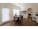 Eat-in kitchen area featuring wood floors and a modern chandelier at 3725 Rifflewood Way, Douglasville, GA 30135