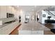 Well-equipped kitchen featuring granite counters, ample cabinets, and an island at 3725 Rifflewood Way, Douglasville, GA 30135
