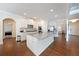Open-concept kitchen featuring granite counters, an island, and stainless steel appliances at 3725 Rifflewood Way, Douglasville, GA 30135