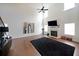 Spacious living room with a fireplace, tall ceilings, and large windows at 3725 Rifflewood Way, Douglasville, GA 30135