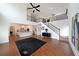 Expansive living room featuring tall ceilings, hardwood floors, and an open layout to the kitchen at 3725 Rifflewood Way, Douglasville, GA 30135
