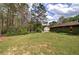 Expansive backyard, with shed and kayaks offers ample space for recreation at 38 E Boxwood Se Dr, Cartersville, GA 30121