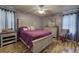 Comfortable bedroom features wood-look floors, ceiling fan, furnishings, and natural light at 38 E Boxwood Se Dr, Cartersville, GA 30121