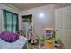 bedroom with closet space and an adjacent play area at 38 E Boxwood Se Dr, Cartersville, GA 30121