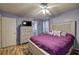 This bedroom offers hardwood floors, a ceiling fan, and a private ensuite bath at 38 E Boxwood Se Dr, Cartersville, GA 30121
