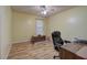 Bedroom featuring a dark office chair, desk, hardwood flooring, and natural light at 38 E Boxwood Se Dr, Cartersville, GA 30121