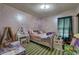 bedroom with patterned carpet, furnishings, natural light, and play area at 38 E Boxwood Se Dr, Cartersville, GA 30121