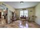 Bright dining room with wood-look laminate floors and sun-filled windows at 38 E Boxwood Se Dr, Cartersville, GA 30121