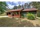 Charming, one-story home featuring a cozy front porch and verdant lawn at 38 E Boxwood Se Dr, Cartersville, GA 30121