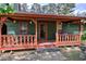 Cozy front porch with a seating area and green exterior at 38 E Boxwood Se Dr, Cartersville, GA 30121