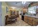 Eat-in kitchen featuring warm wood cabinetry and wood-look laminate floors at 38 E Boxwood Se Dr, Cartersville, GA 30121