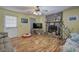 Cozy living room with stone fireplace, wood-look laminate floors, and natural light at 38 E Boxwood Se Dr, Cartersville, GA 30121