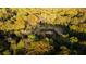 An aerial view reveals the property with a stream nestled in a verdant wooded landscape at 1919 Wellbourne Ne Dr, Atlanta, GA 30324