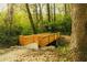 A wooden bridge in a green natural wooded area offers a tranquil escape at 1919 Wellbourne Ne Dr, Atlanta, GA 30324